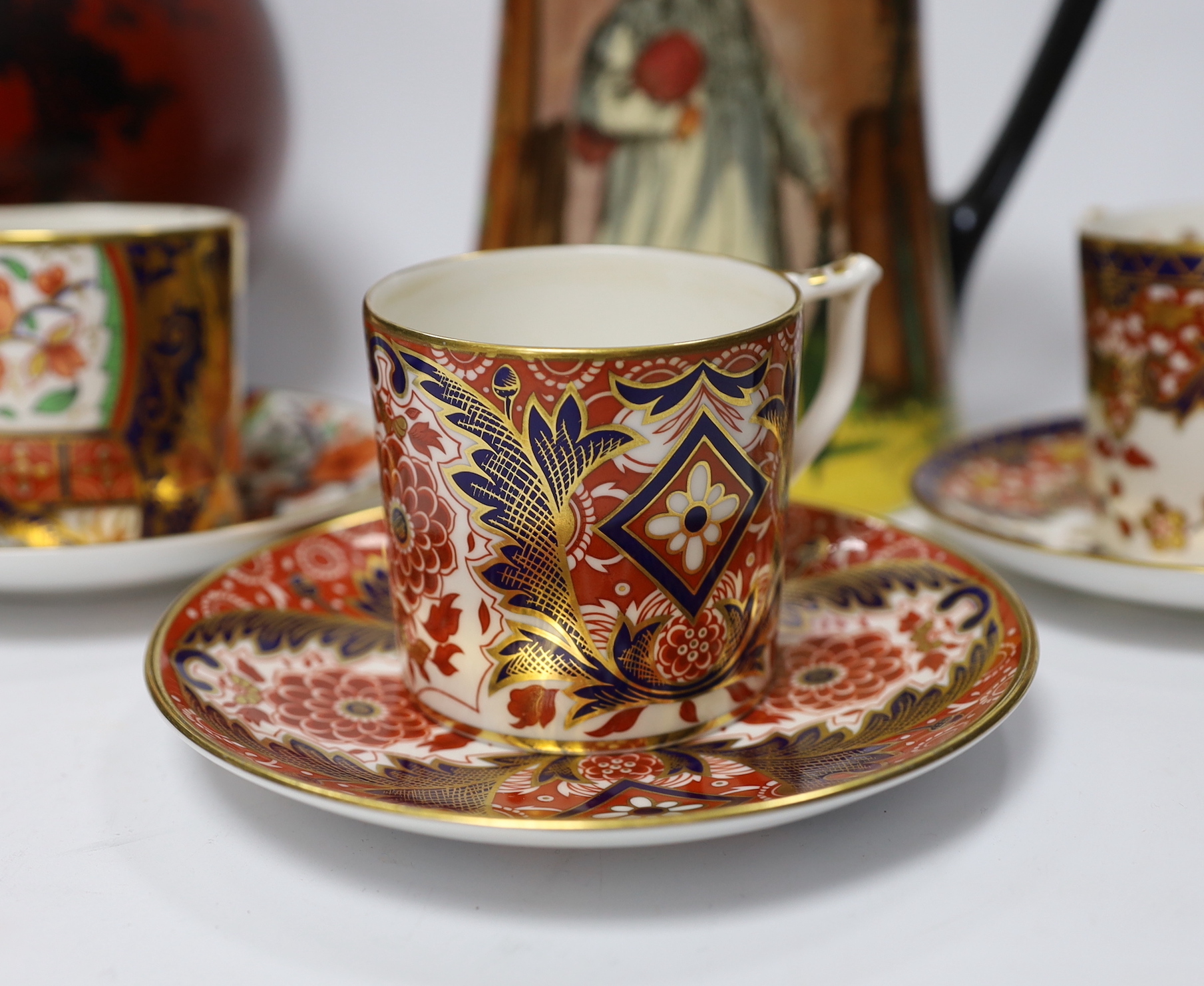 A Doulton flambé vase, a Gaffers Seriesware jug and Royal Crown Derby Imari cups and saucers, tallest 25.5cm